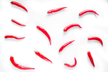 red food with chili pepper on white background top view pattern