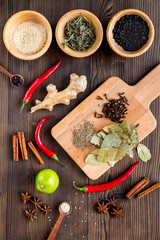 Cooking with spices, salt and pepper on kitchen table background top view