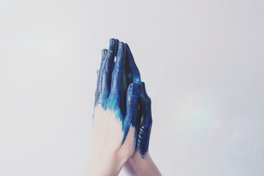 Painted blue hands