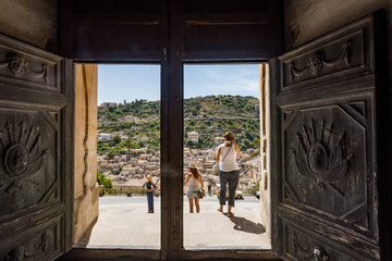 Obraz na płótnie Canvas View through the door of the baroque San Giorgio cathedral of the town of Modica in southern Sicily in Italy.