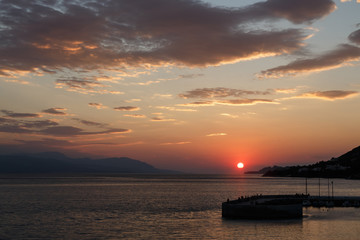 Beautiful sunset with sea and pier, Loutraki, Grecee