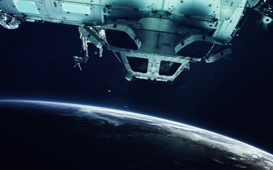 Space station and Earth planet. Elements of this image furnished by NASA