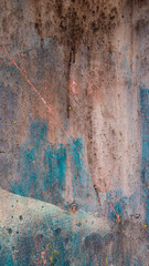 abstract grunge texture of rusty iron with beige, brown and blue blur, vertical frame