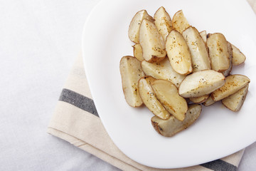 Baked potatoes on a white plate. Organic Vegetarian Food