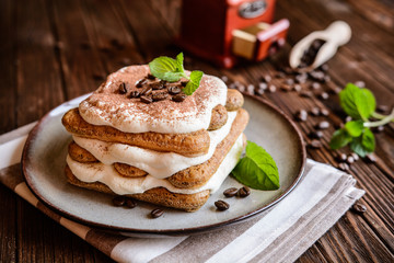 Traditional delicious Tiramisu cake served on a plate