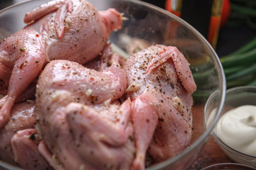Homemade eco-friendly raw quails ready for cooking.