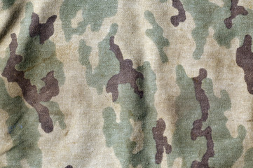 Weathered camouflage uniform pattern. © pavelalexeev