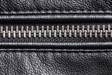 Black leather metal zipper closeup macro texture. © Paweł Michałowski