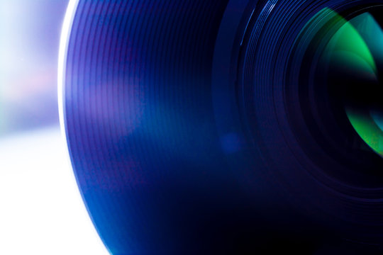 Lens of a SLR camera close-up macro with sunbeams glare sun rays