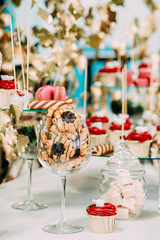 Dessert Sweet Tasty Cupcakes, Cookies In Candy Bar On Table.
