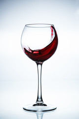 Wine splashing in glass