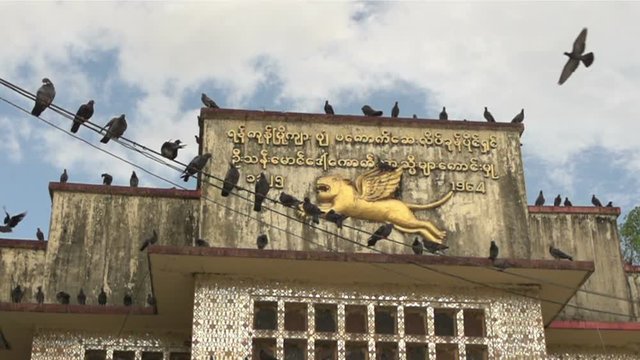 Pathein, pigeons flying over at Shwemokehtaw Pagoda