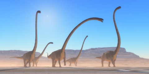 Omeisaurus Dinosaur Desert - An Omeisaurus herd walks across a dry desert in their search for vegetation and water in the Jurassic Period. © Catmando