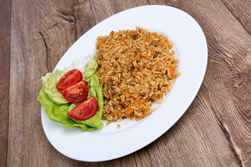 Vegetarian food on  plate with wooden background