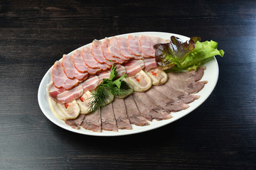 Platter of assorted cold cut meat slices