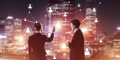 Obraz premium Concept of social connection and networking against night city v