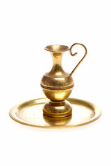 Fototapeta na wymiar Antique brass vase on golden tray isolated on white