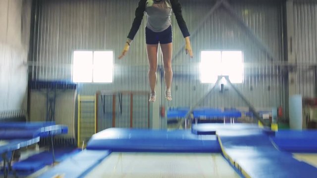 Athlete jumping on the trampoline