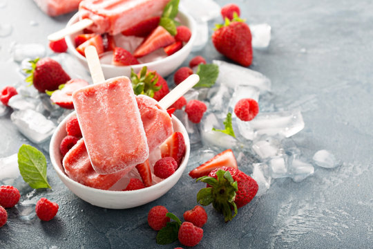 Strawberry and raspberry popsicles