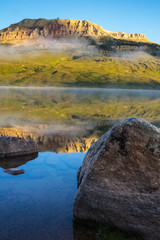 Sunrise on lake with Bear to Butte in the background, Montana