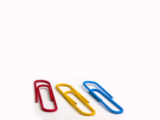 Colorful paper clip on white background..