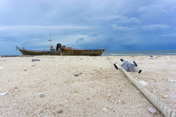 Close up to the ropes used to tie fishing boats. With the blue sky  background