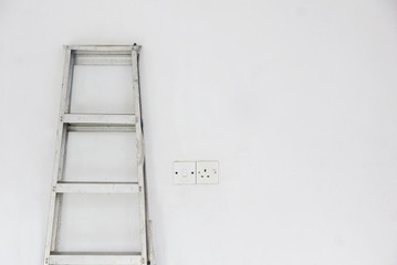 Capacity Platform Step Ladder and plug socket over white background