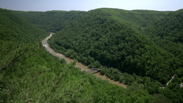 A high angle summer establishing shot of the New River Gorge in West Virginia.  	