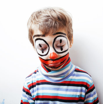 little cute boy with facepaint like clown, pantomimic expression