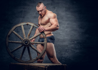 Fototapeta na wymiar Portrait of shirtless muscular bodybuilder slave male.