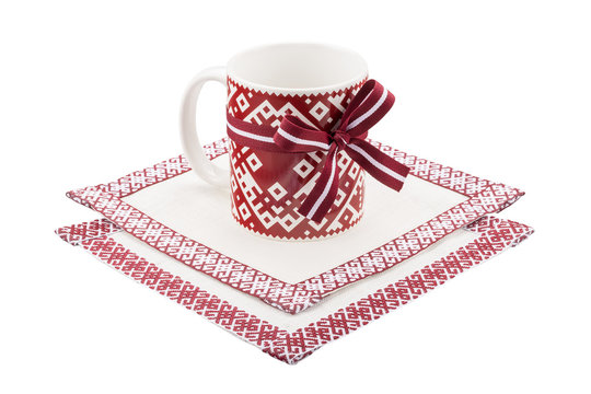 Mug and tablecloth with national latvian ornament