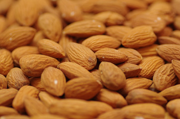 Closeup of a delicious peeled almonds . For vegetarians