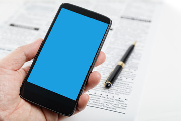 fake newspaper and smartphone