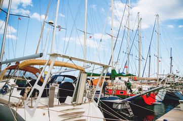 Fototapeta premium Rigging of the boat. The stern of the yacht with equipment and fasteners. Two passenger ships moored in sea port El Kantaoui, Tunisia.