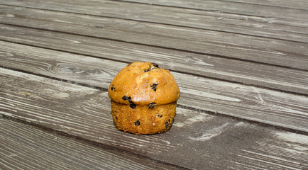 Cupcake on a background of old wood