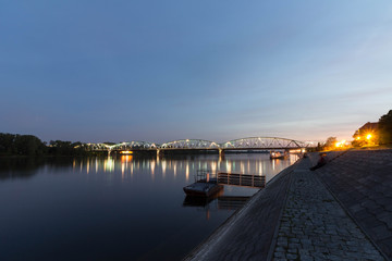 Picturesque night view of the Pilsudski bridge over Wisla (Vistula) river in Torun