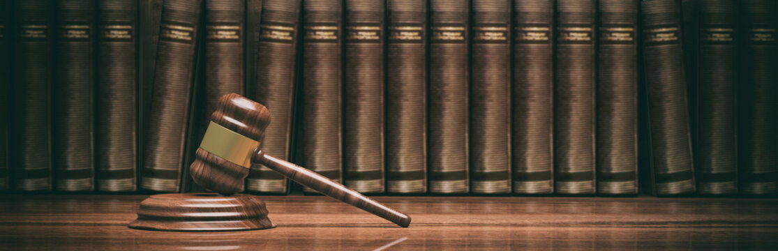 Wooden judge gavel and law books. 3d illustration