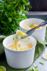 Breakfast with eggs baked with onion in porridge bowls, selective focus