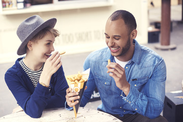 Young couple over dinner time © gpointstudio