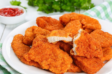 crispy chicken nuggets cut in half