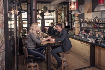 indoors coffee shop interior, small groups of people