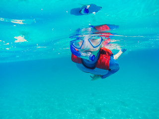 Underwater Young Boy Fun in the sea with snorkel. Summer Vacation Fun.