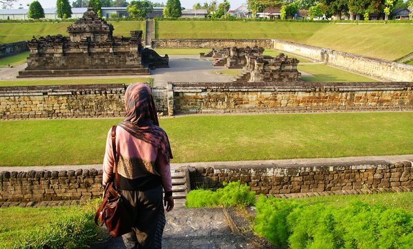 A tourist visiting Sambisari Temple in Yogyakarta, Indonesia