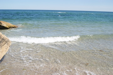  Sand on the beach, waves with white foam