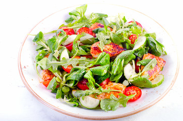 Healthy salad with chicken breast, cucumber  and tomato