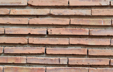 Wall of narrow old brick, background