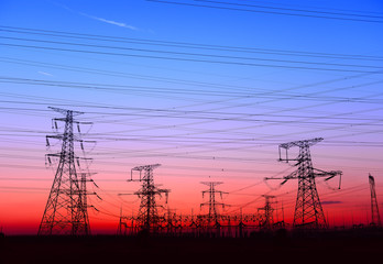 Fototapeta premium High piezoelectric towers, in the setting sun