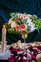 Served table with bouquet and candles