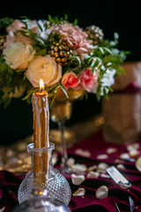 Served table with bouquet and candles