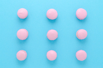 pink macaroons homemade on blue background